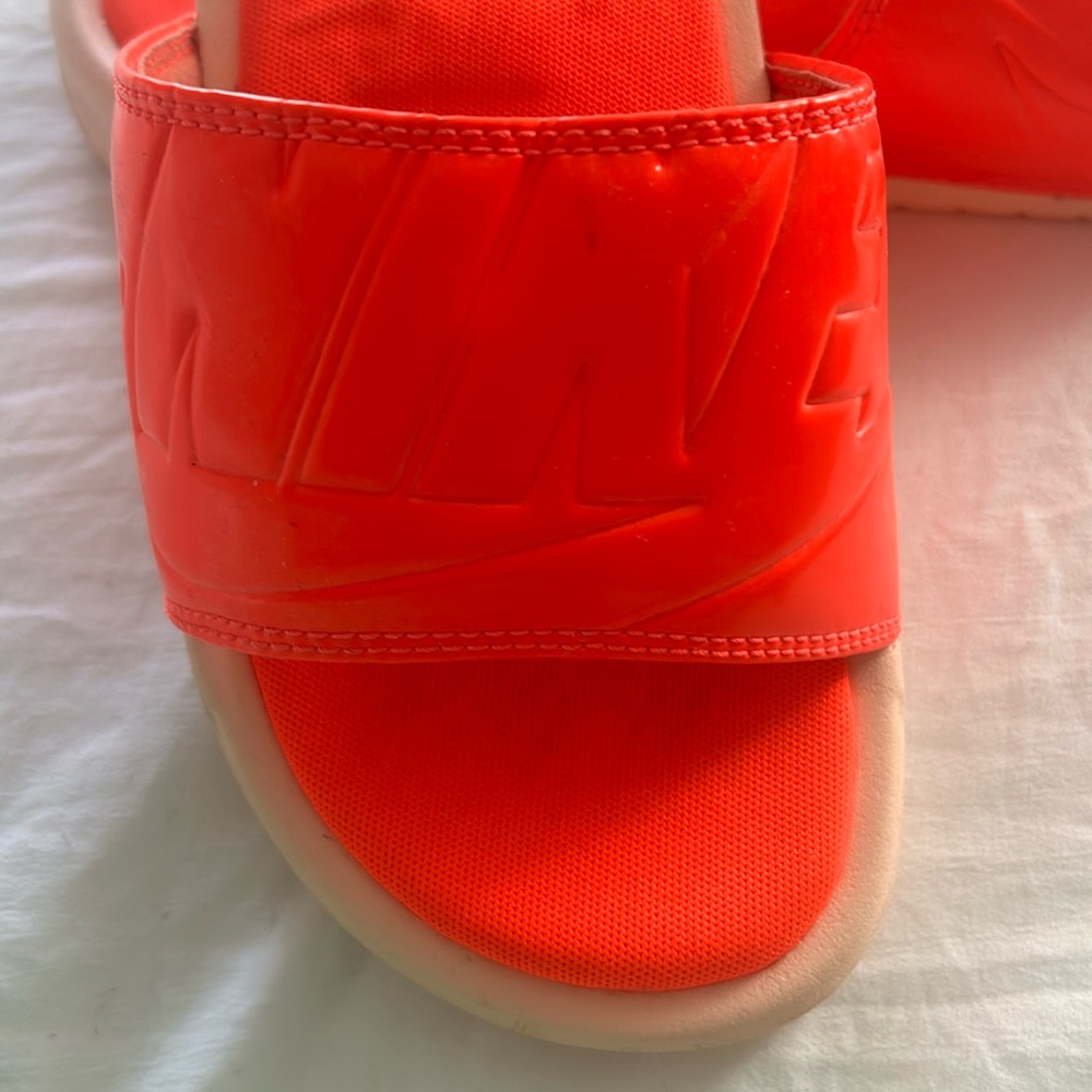 Orange, Nike slipper slides selling because they don’t fit